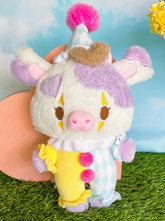 This plushie packs a punch with its clown-style outfit and smile, spreading laughs and good vibes wherever it goes! Who said clowns were only for circuses?